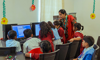 Teacher helping students in classroom
